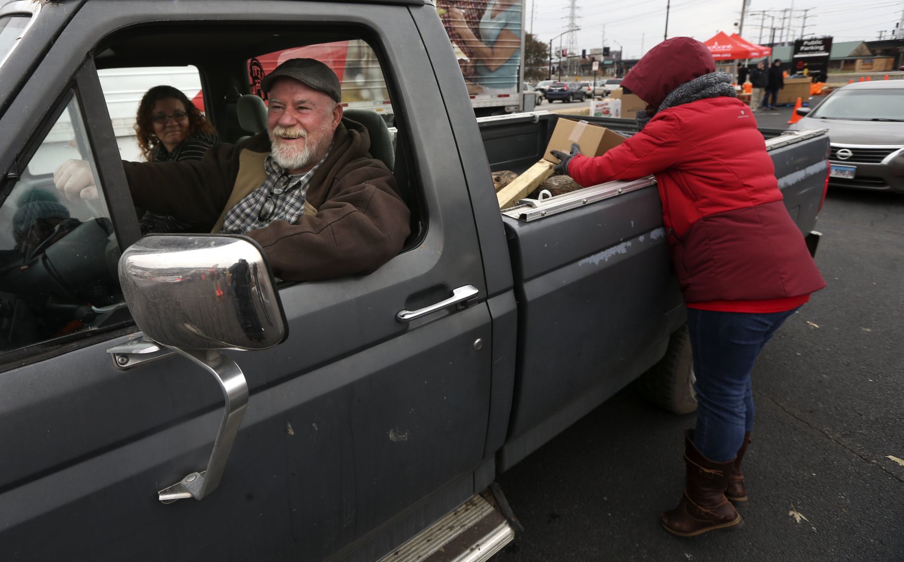 Volunteers hand out food during 'Thanksgiving Together' event